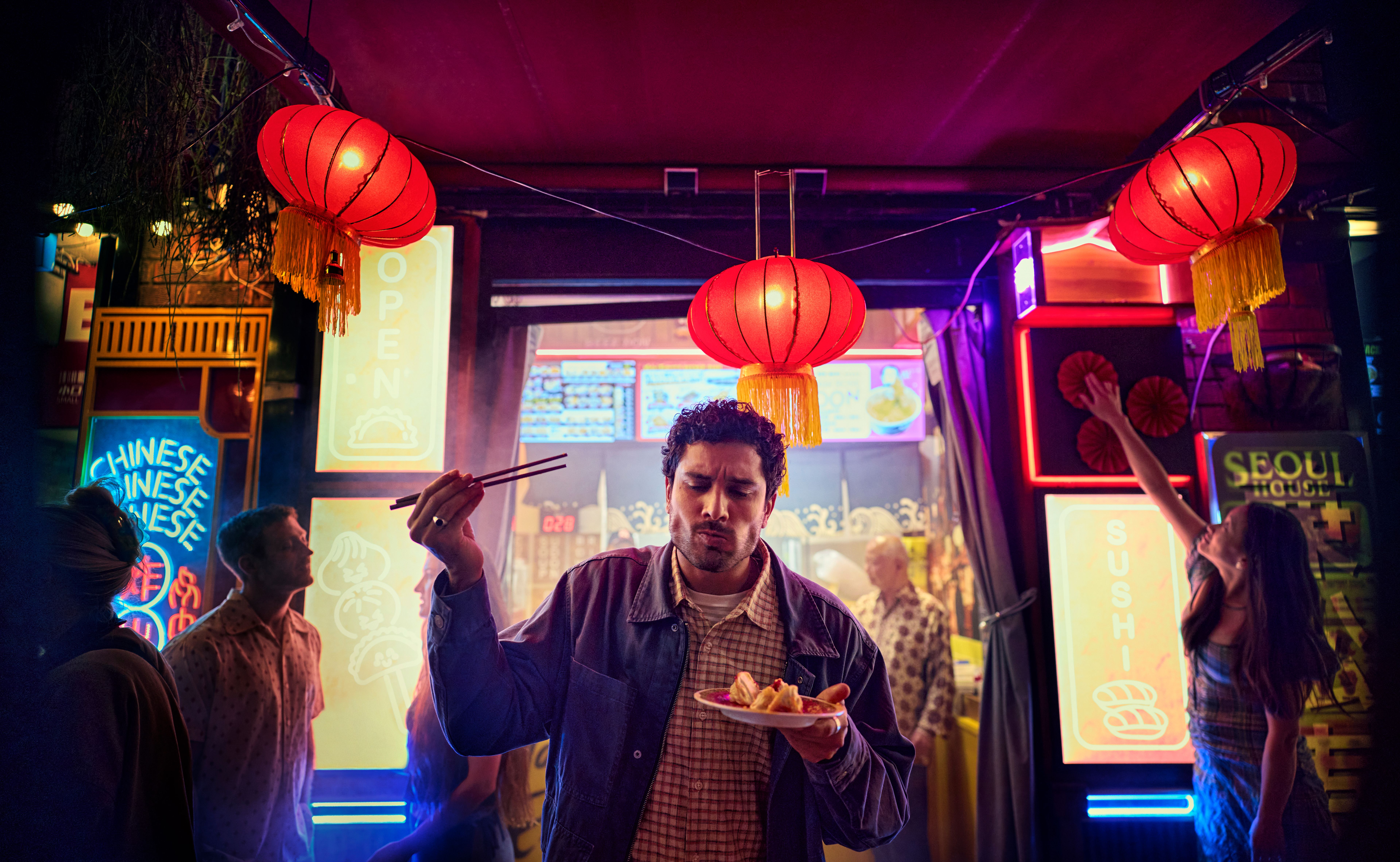 A person eating noodles