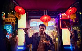 A person eating noodles