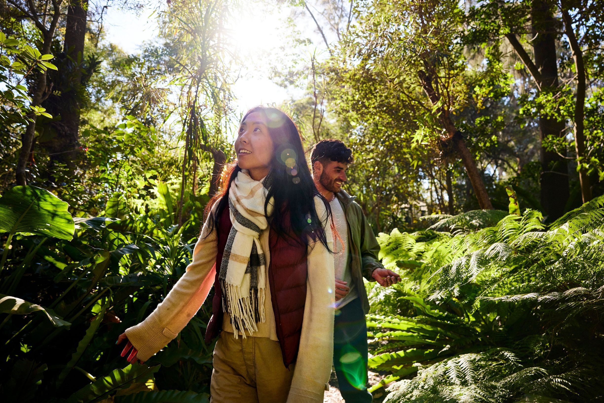 Couple walking through Sylvan Grove Native Garden in Picnic Point