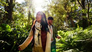 Couple walking through Sylvan Grove Native Garden in Picnic Point