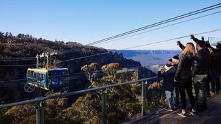 Family waving to people on skyway