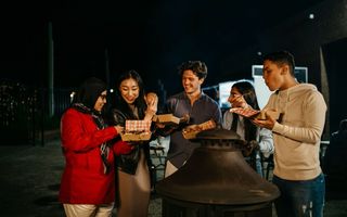 Group of friends eating food in Bankstown