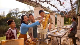 Family harvest honey at Bowral Honey Farms