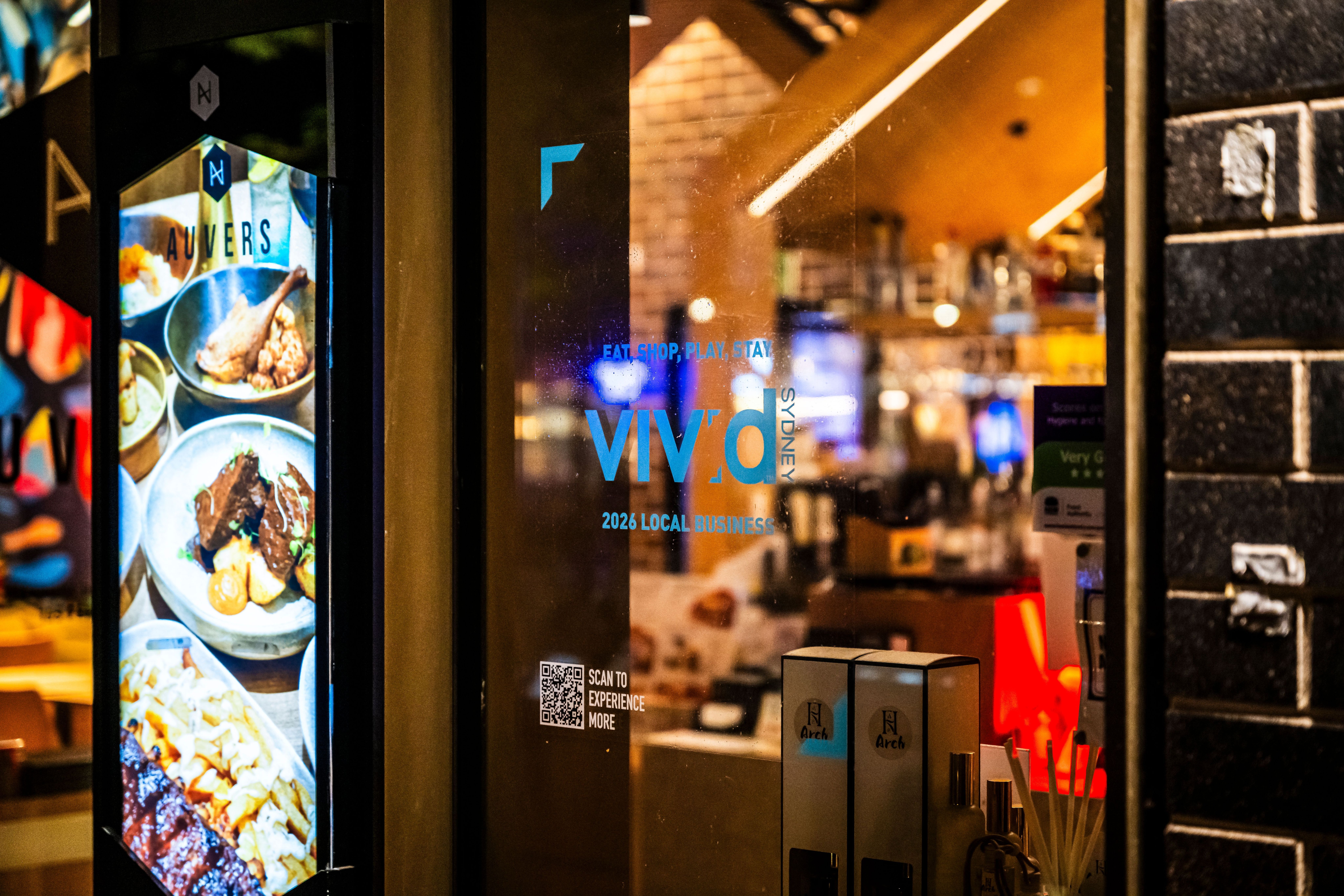 Restaurant window with Vivid Sydney Local Business Program decal
