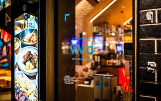 Restaurant window with Vivid Sydney Local Business Program decal