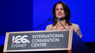 NSW Visitor Economy Forum MC Rae Johnston at the podium