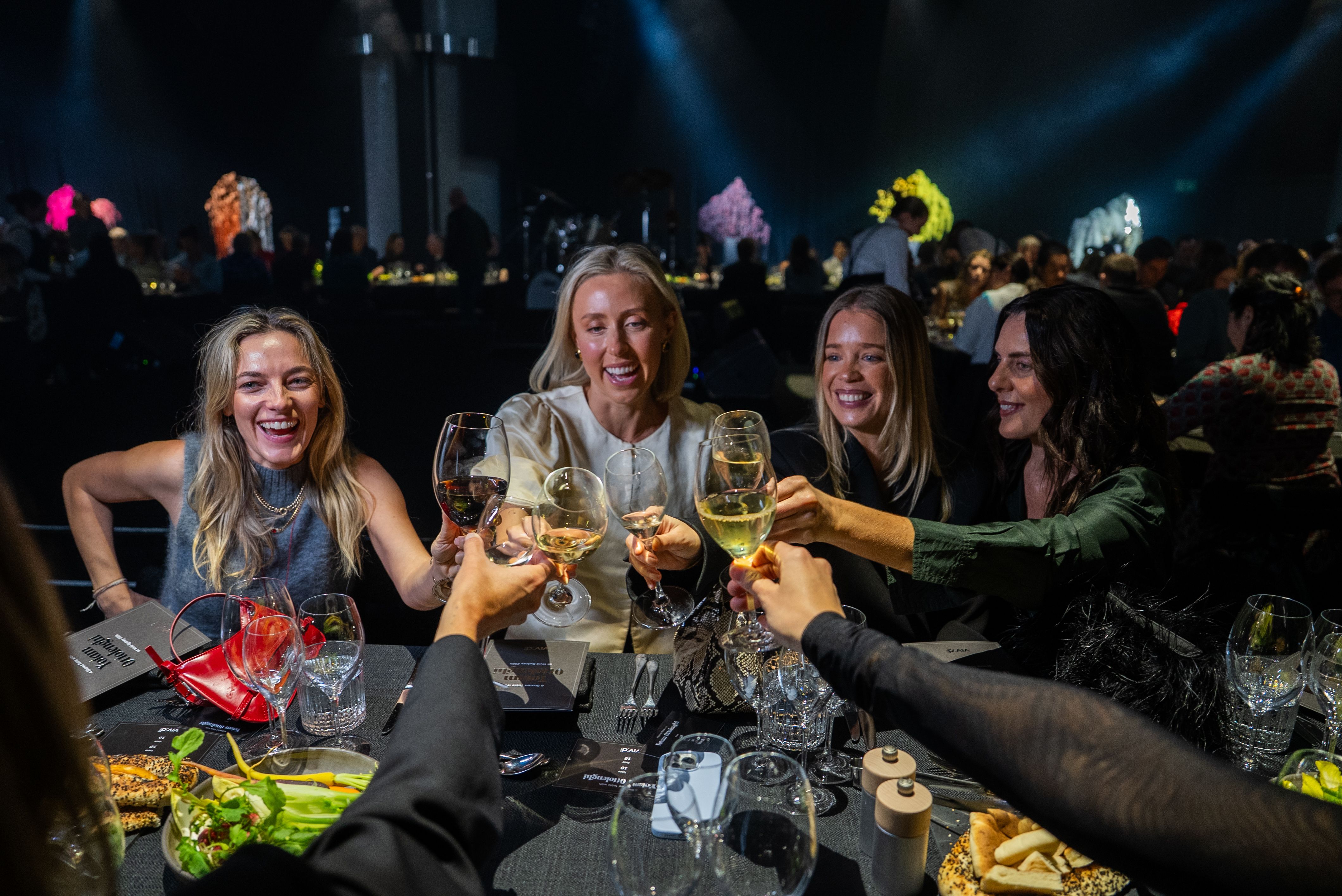 Women raise their glasses at Regional Dinner Series event
