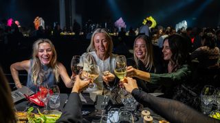 Women raise their glasses at Regional Dinner Series event