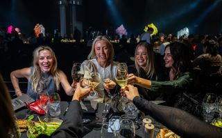 Women raise their glasses at Regional Dinner Series event