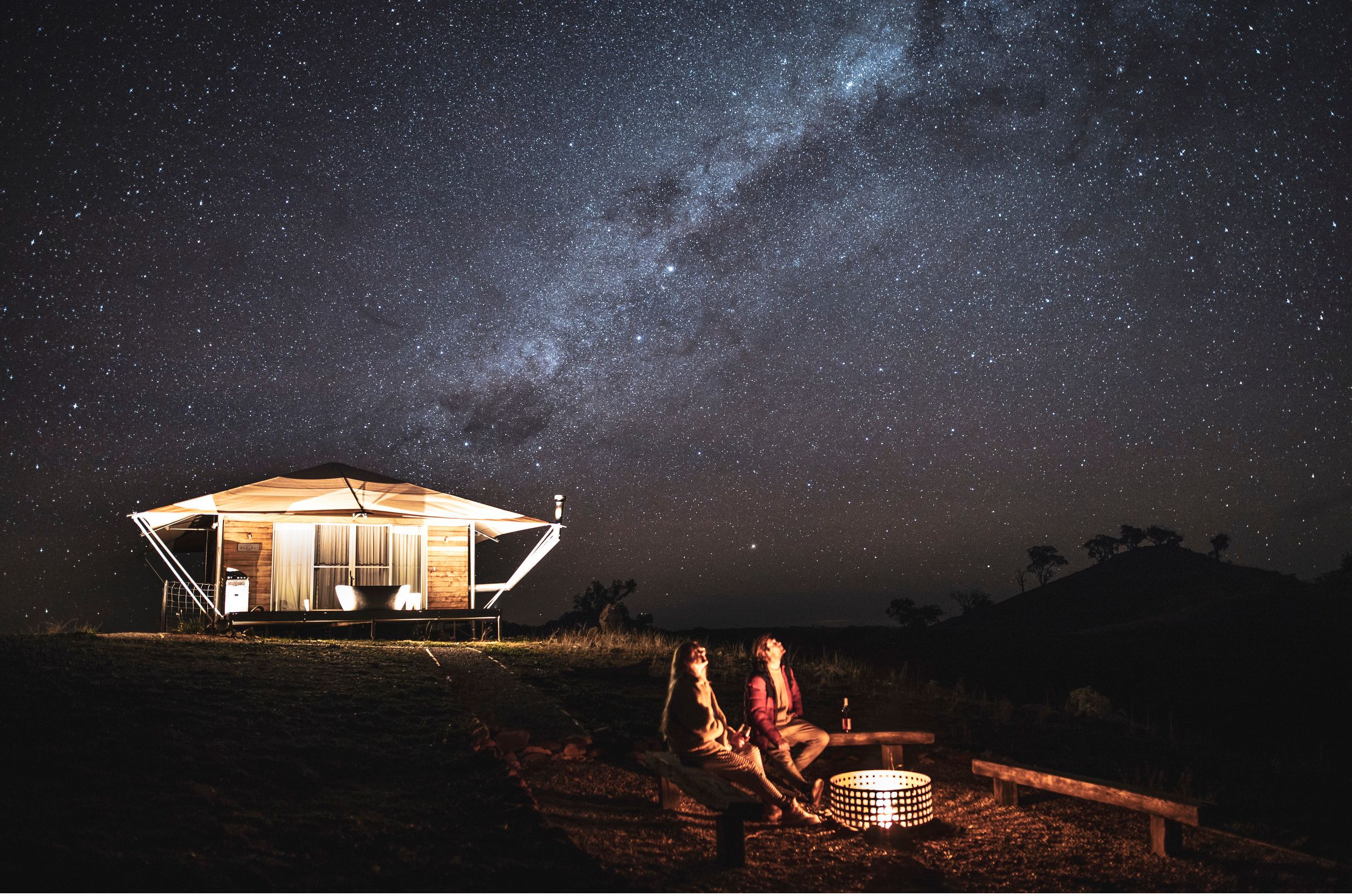 Couple stargazing from the Dulli Tent at Sierra Escape, Piambong.