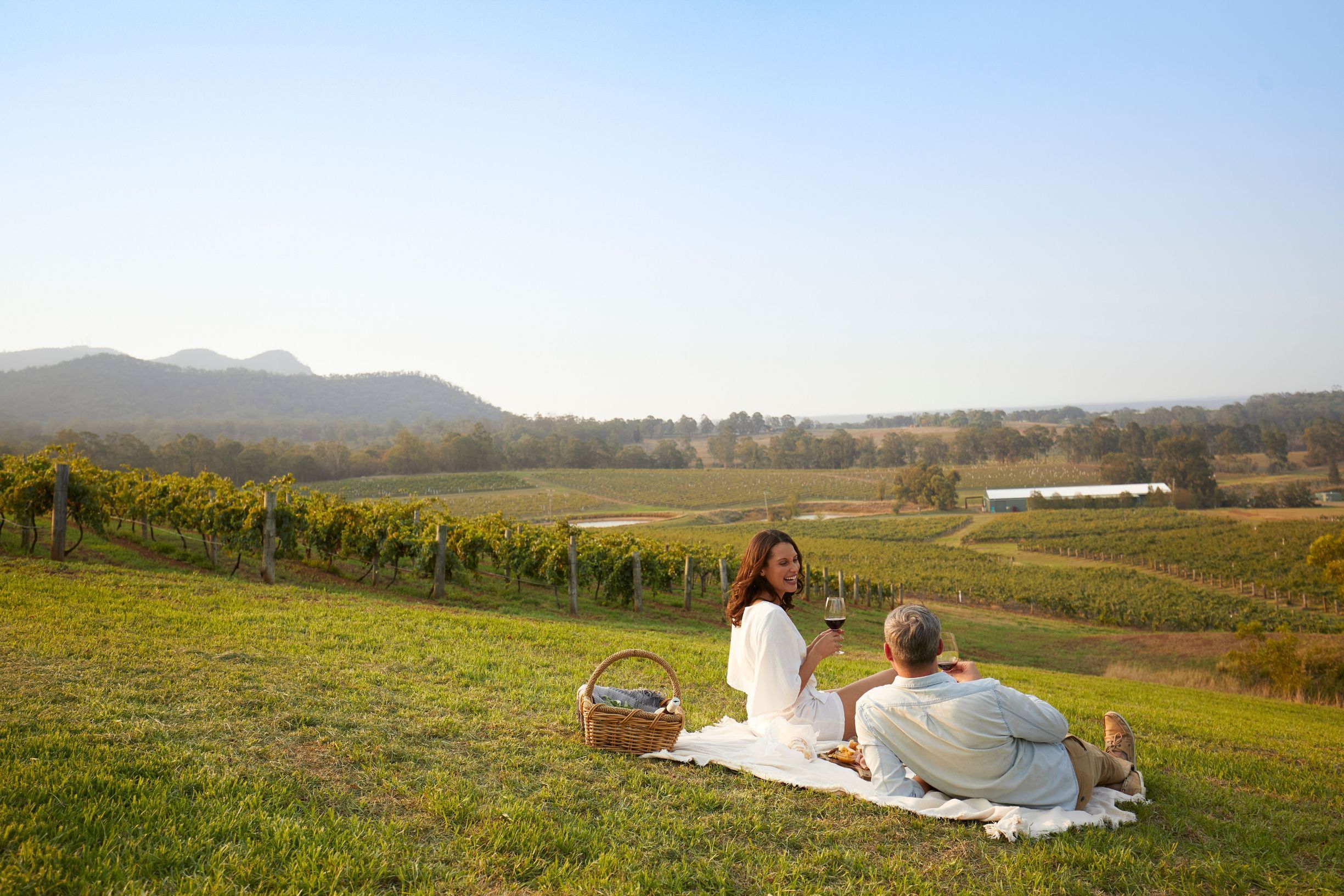 Couple enjoying a picnic at Audrey Wilkinson vineyard