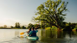 Couple enjoys a paddle down Bellingen River