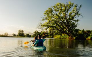 Couple enjoys a paddle down Bellingen River