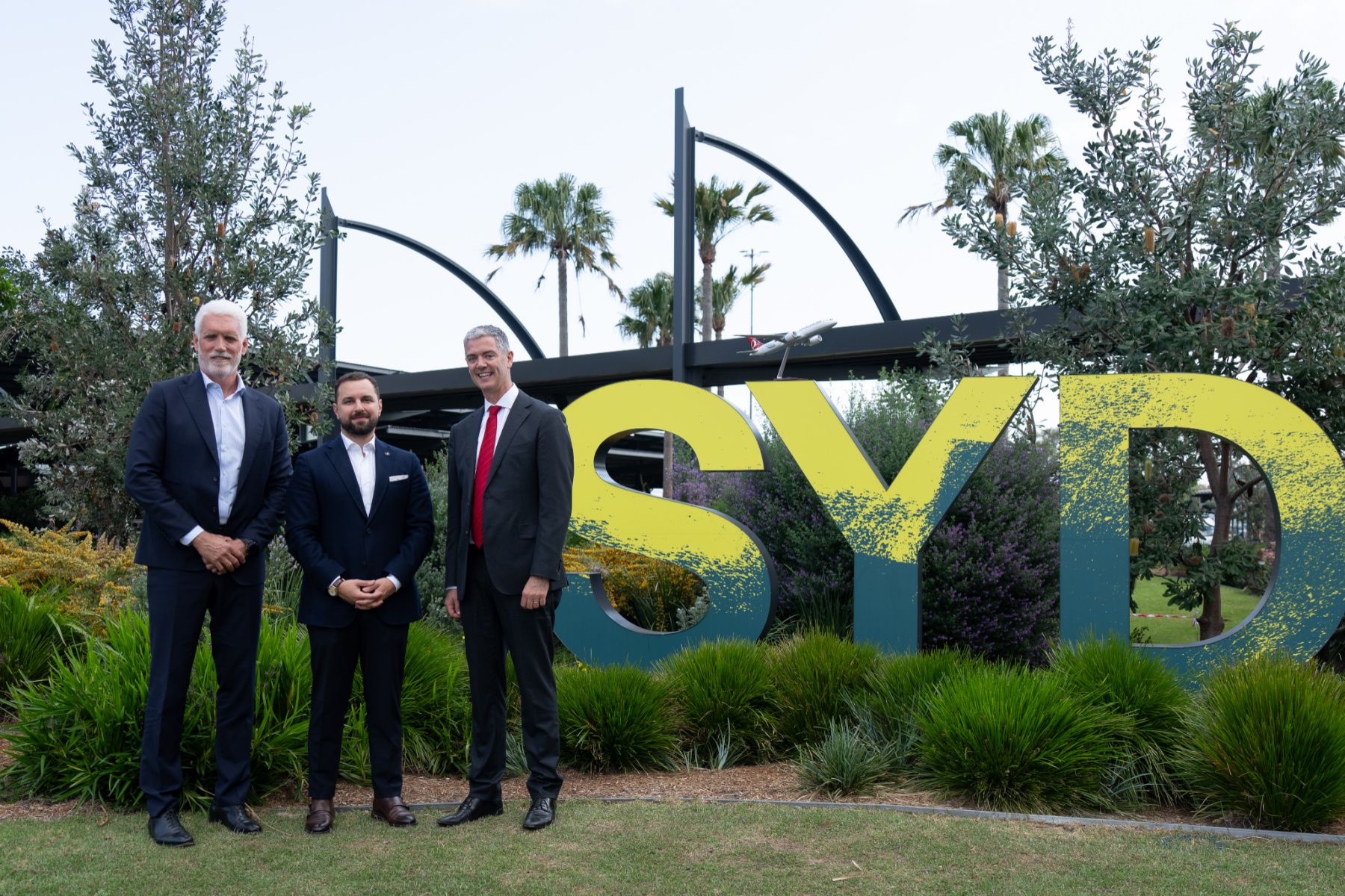 Senior executives outside Sydney Airport