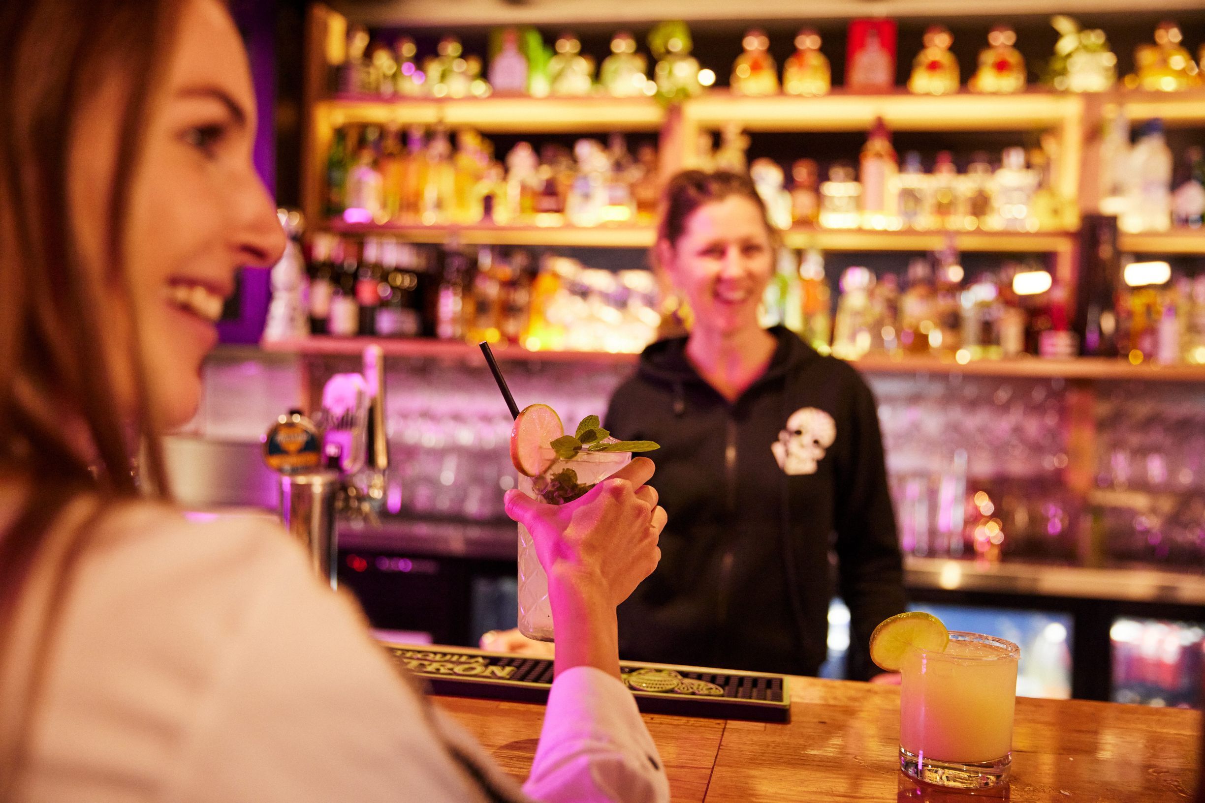 Woman with cocktail at Mexican restaurant
