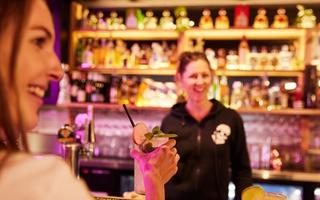 Woman with cocktail at Mexican restaurant