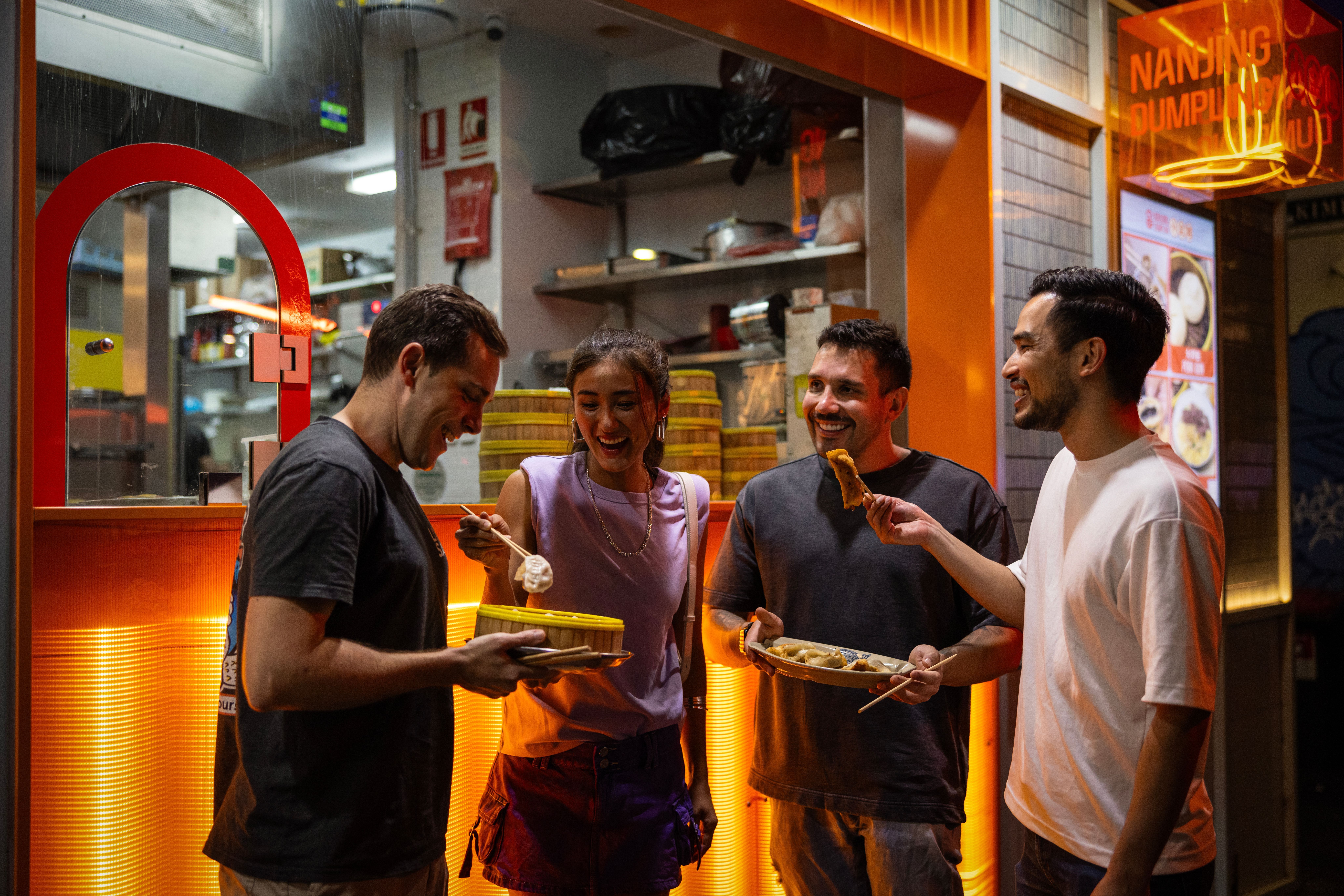 Friends enjoying food in Chinatown