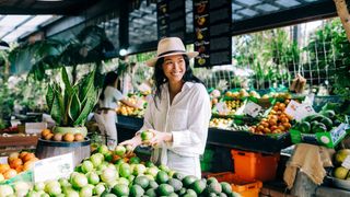 Woman purchasing fresh produce from Tropical Fruit World, Duranbah.