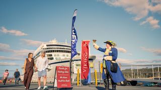 Cruise passengers arrive in the Port of Eden