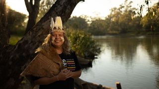 Host Ruth Davys in traditional dress for Wiradjuri Storytellers Sculpture Trail Tours by the Murray River.