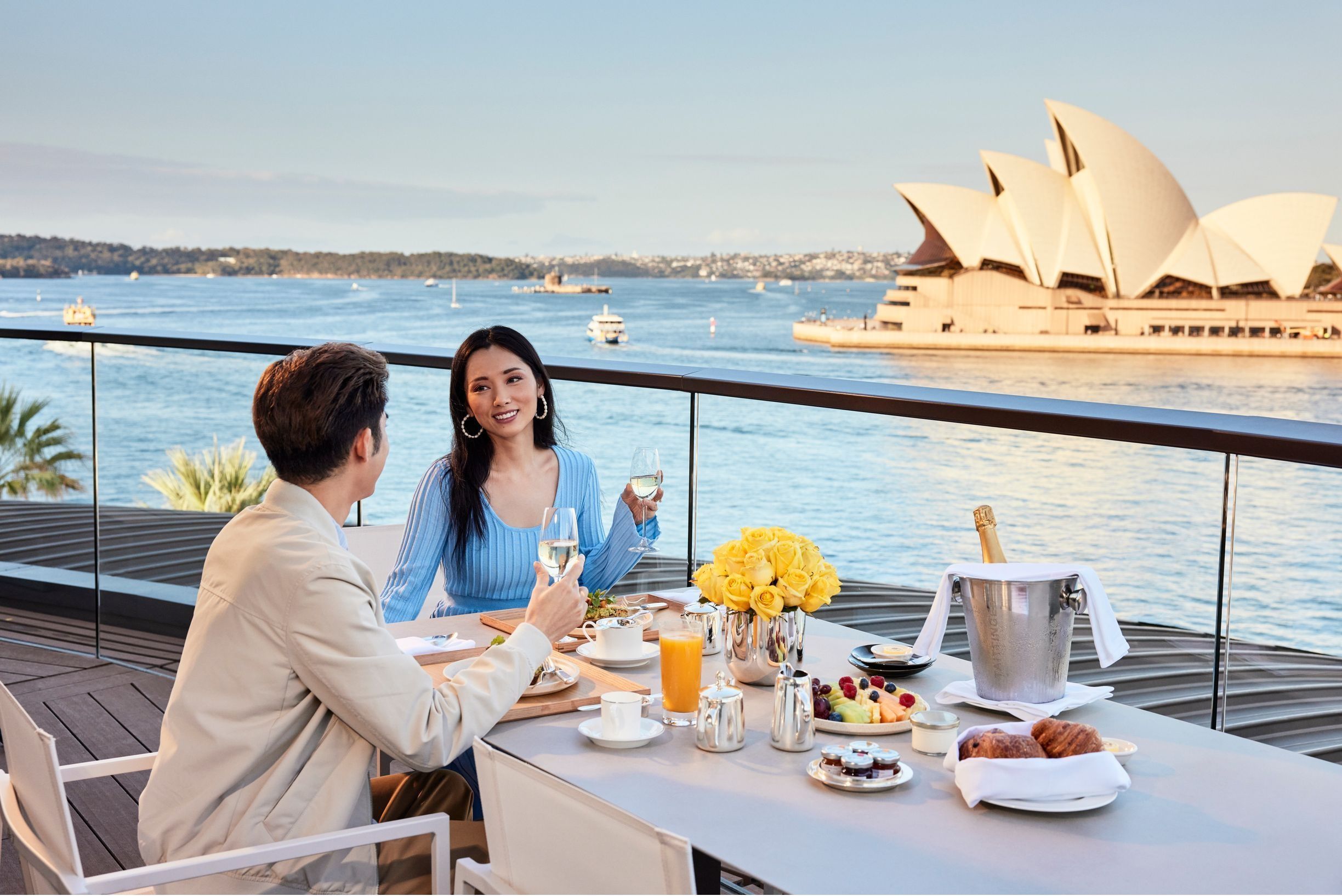 Couple enjoying meal on balcony of Park Hyatt, Sydney