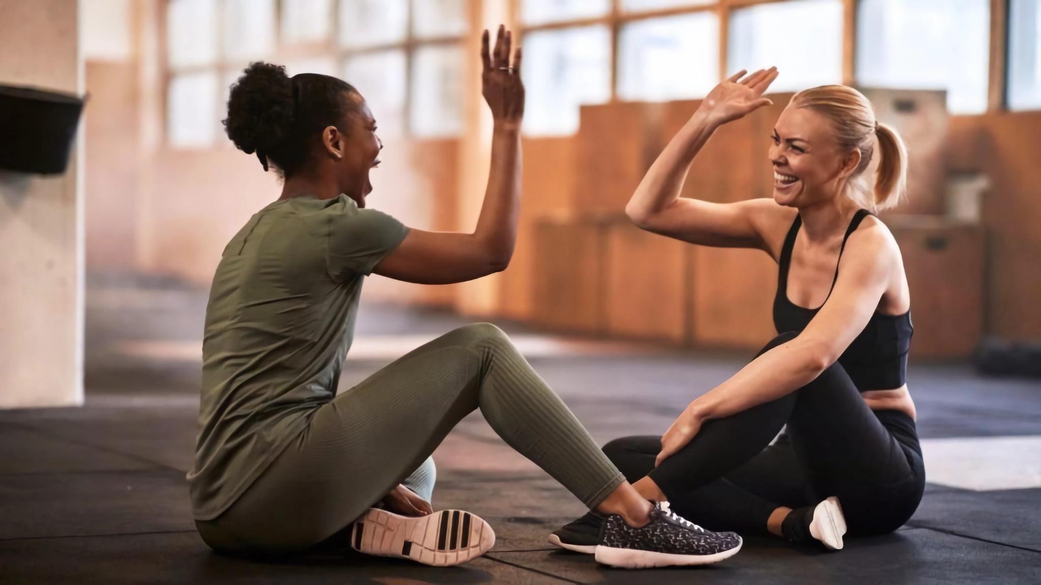 two women training and high fiving