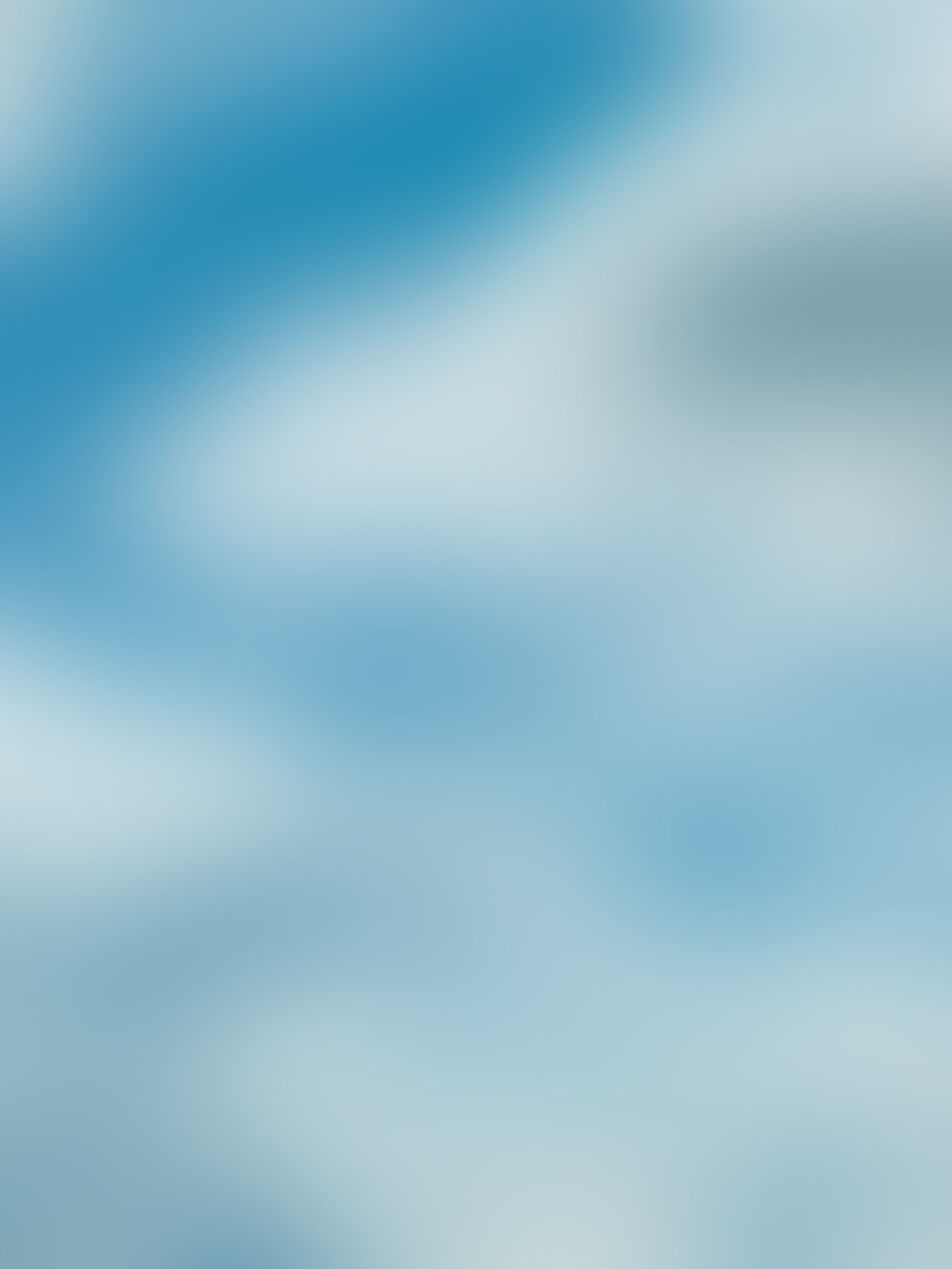 Blurred abstract background of light blue and white.
