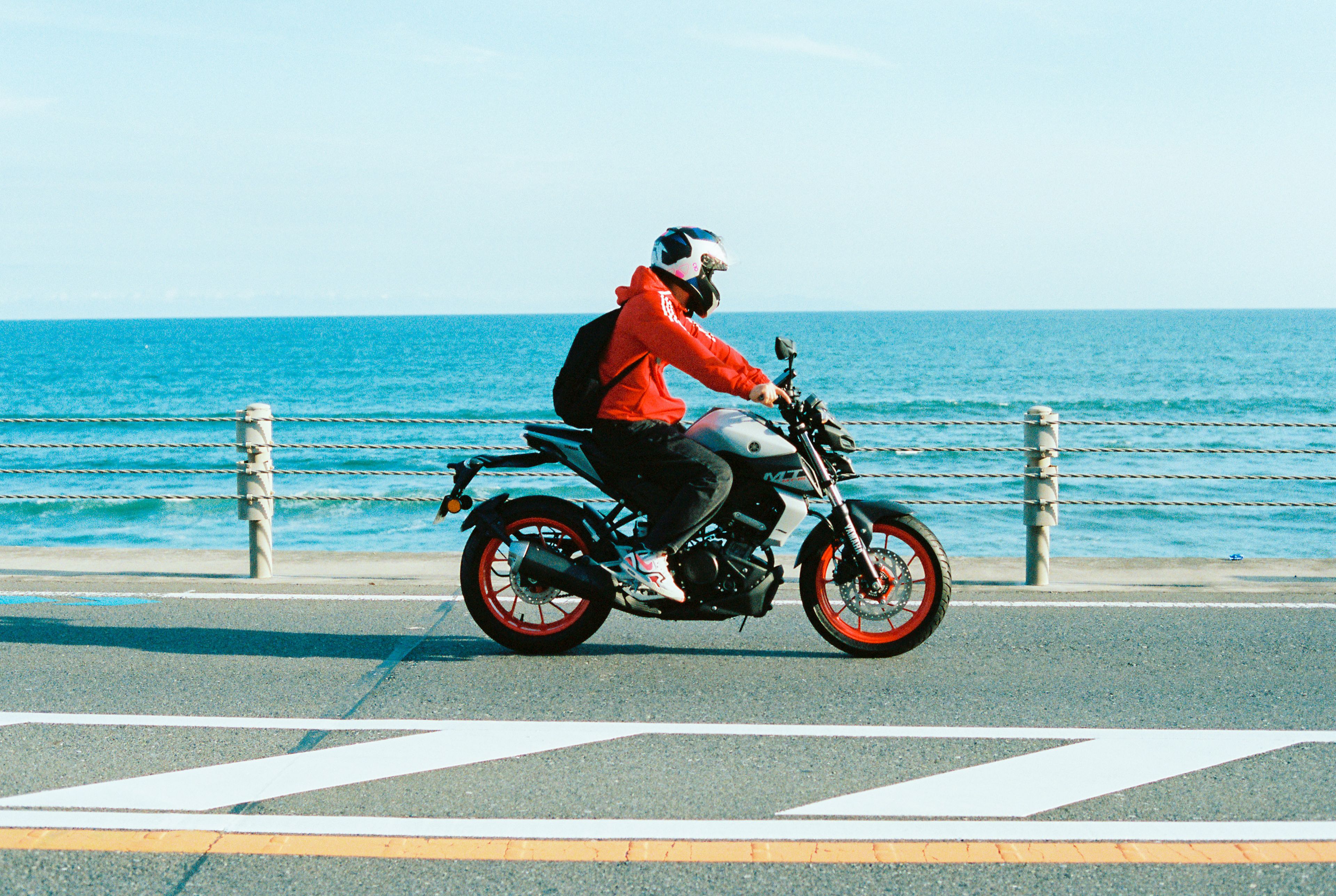 MOTORCYCLIST BY THE OCEANSIDE ABOVE SHICHIRIGAHAMA BEACH, 2026.