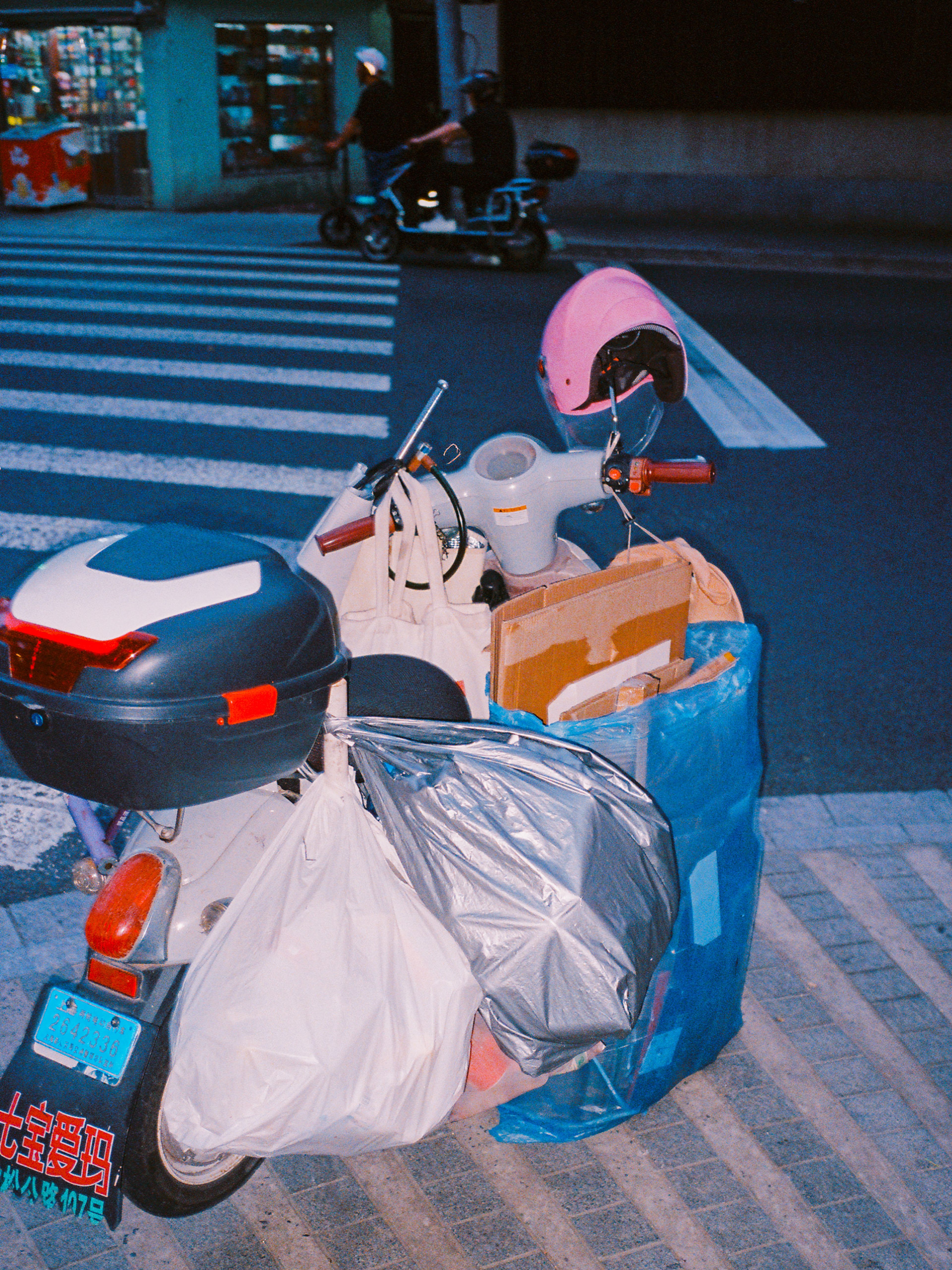 SCOOTER FULL OF BAGS IN SHANGHAI, 2025.