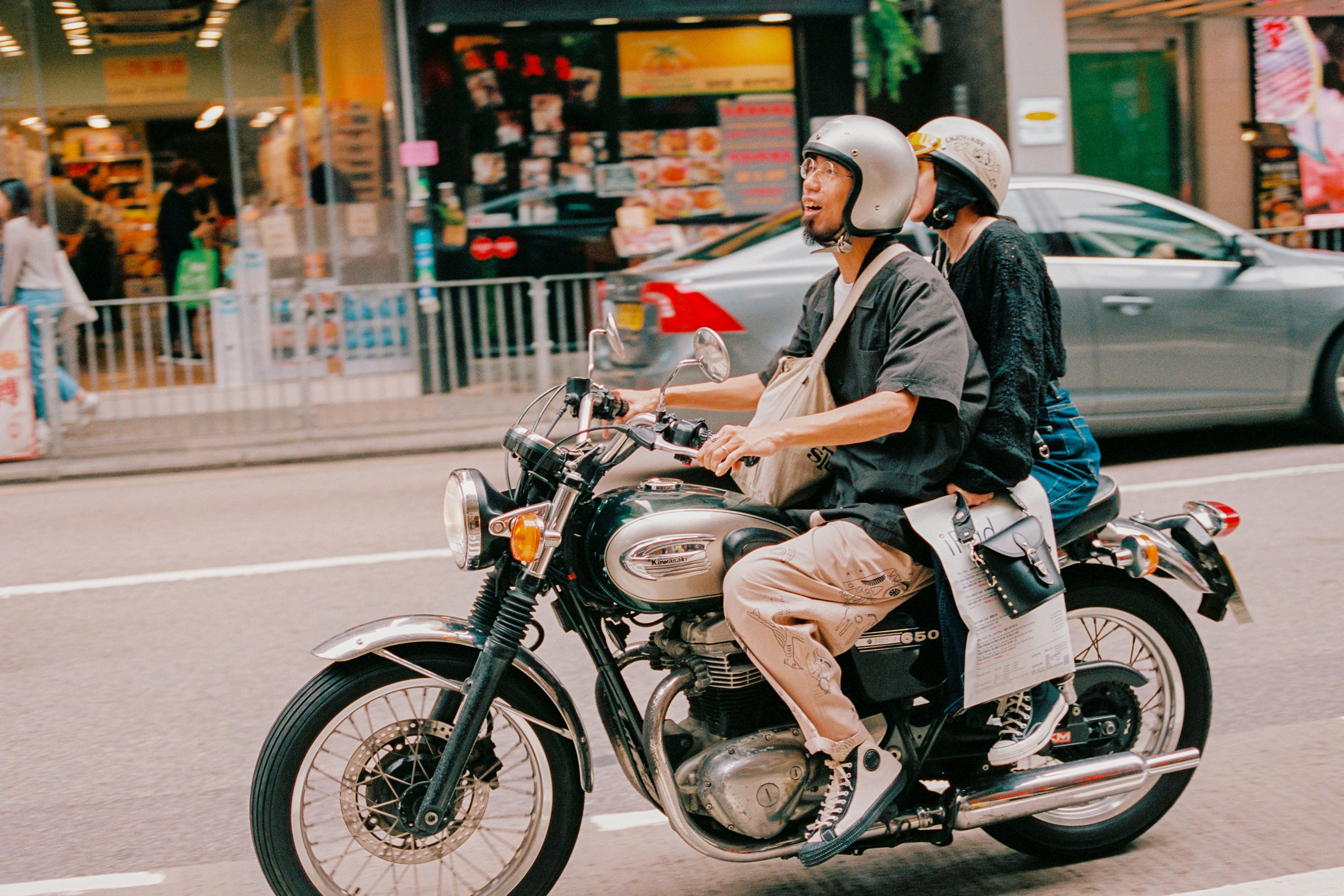 A COUPLE ON A MOTORBIKE IN WAN CHAI, 2025.