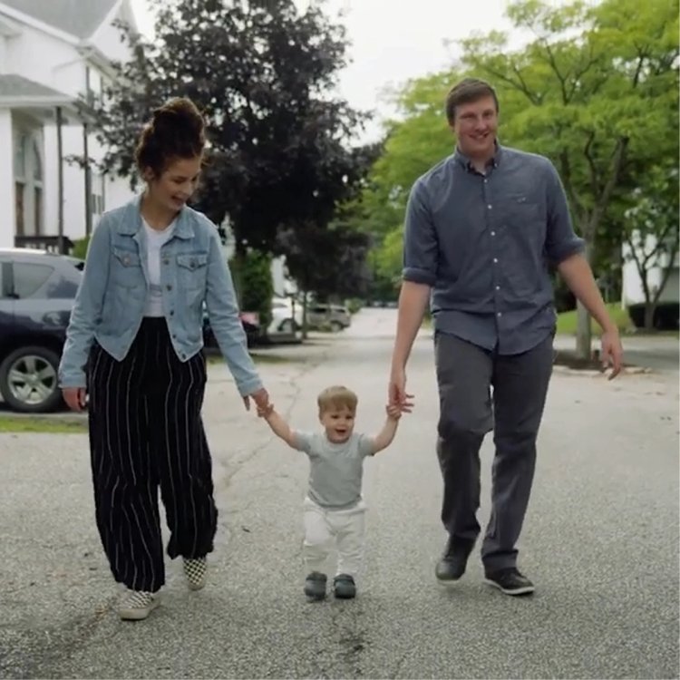 Jessica walking with partner and baby