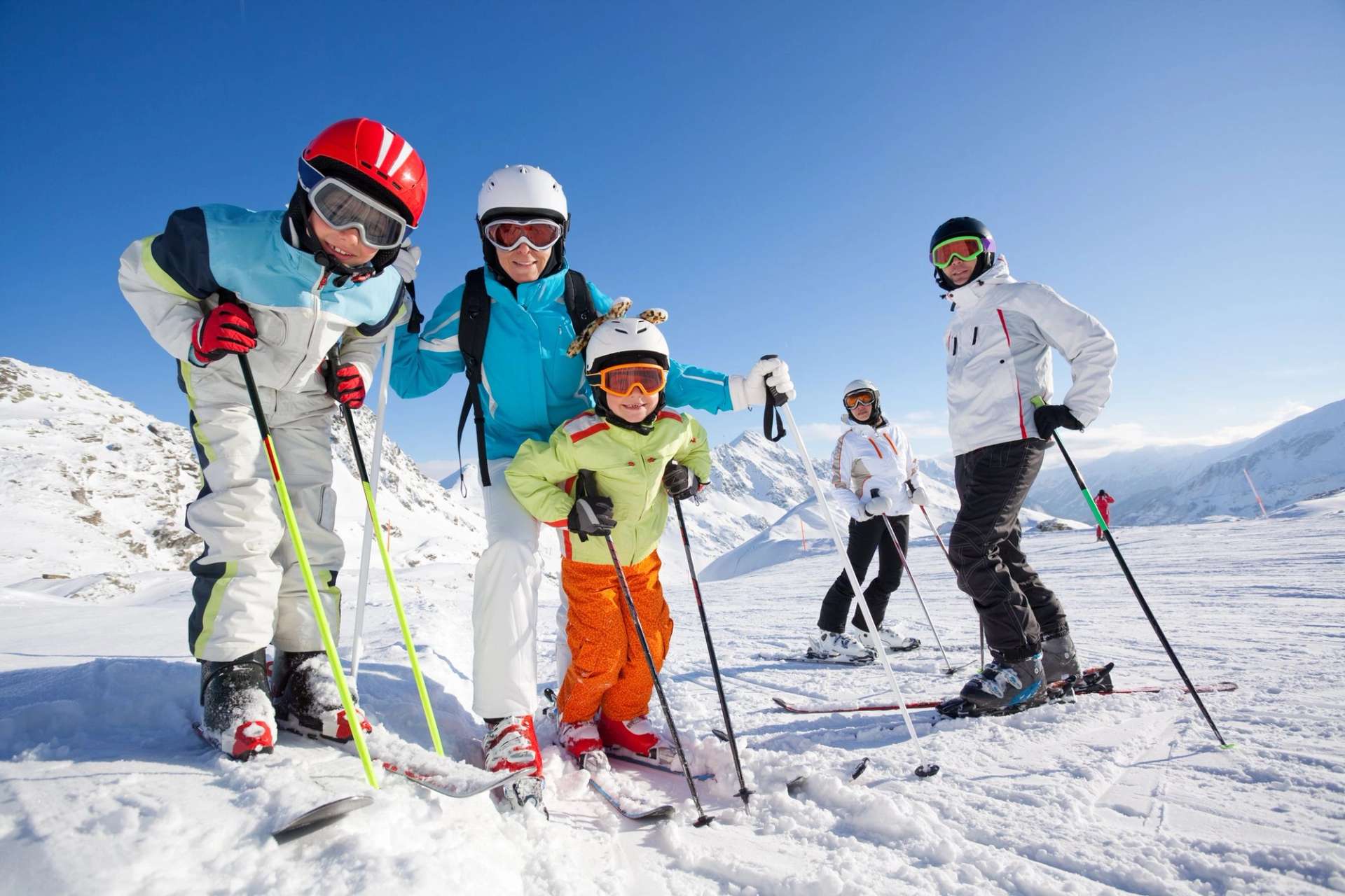 Private shuttle trip at Coronet Peak with snow-covered backdrop and guests preparing for the day