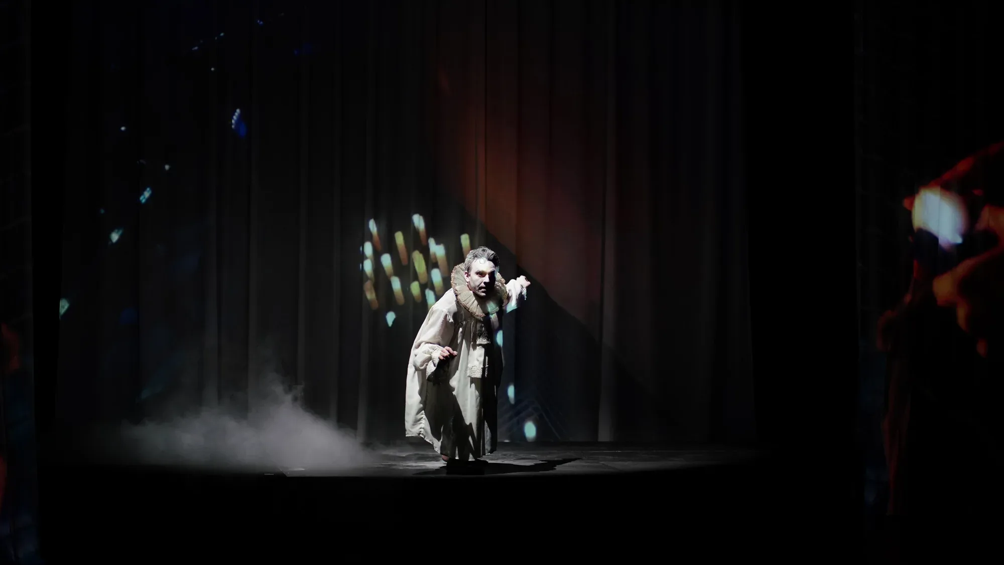 A pale figure in the smoke.