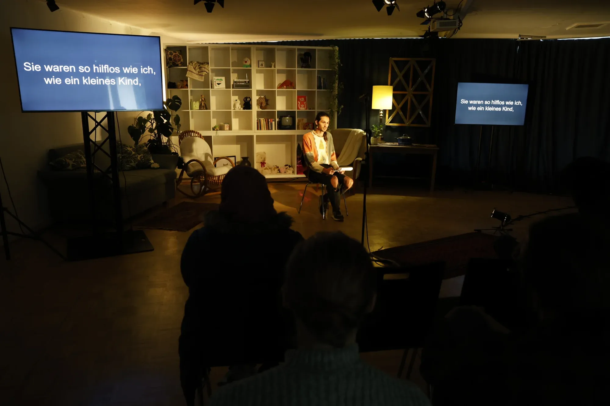The audience follows the reading and the subtitles.