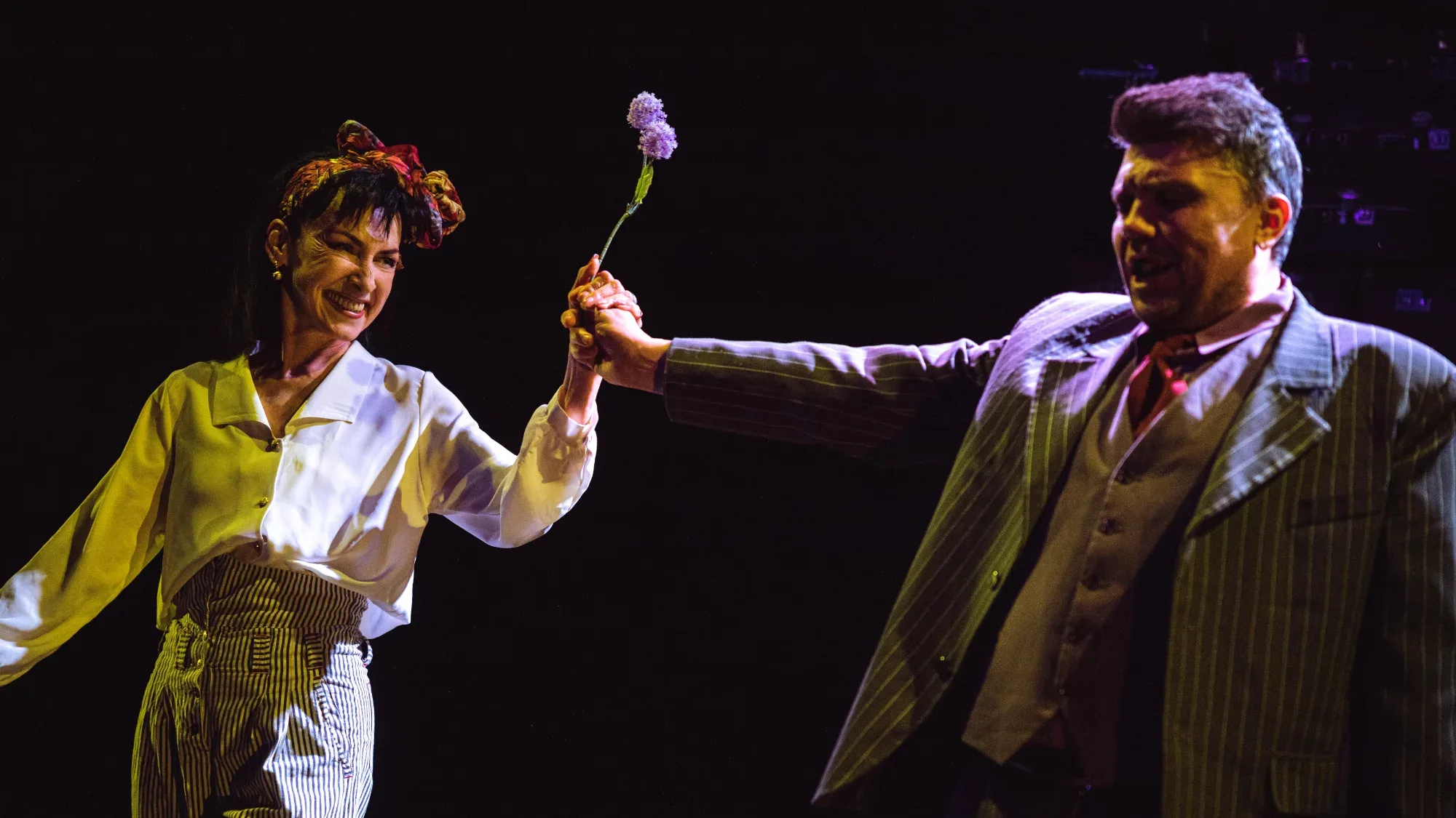 The flower between them.