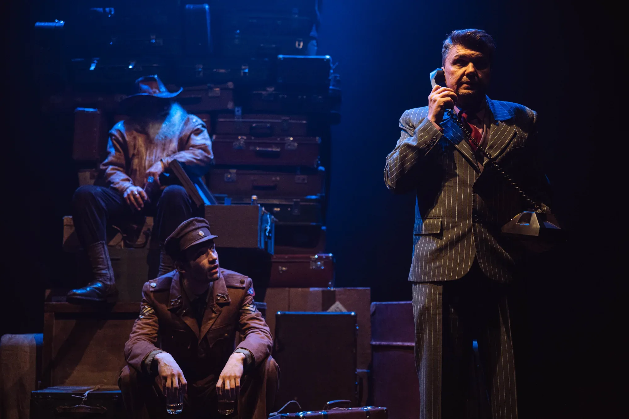 A scene from the production: a man on the telephone.