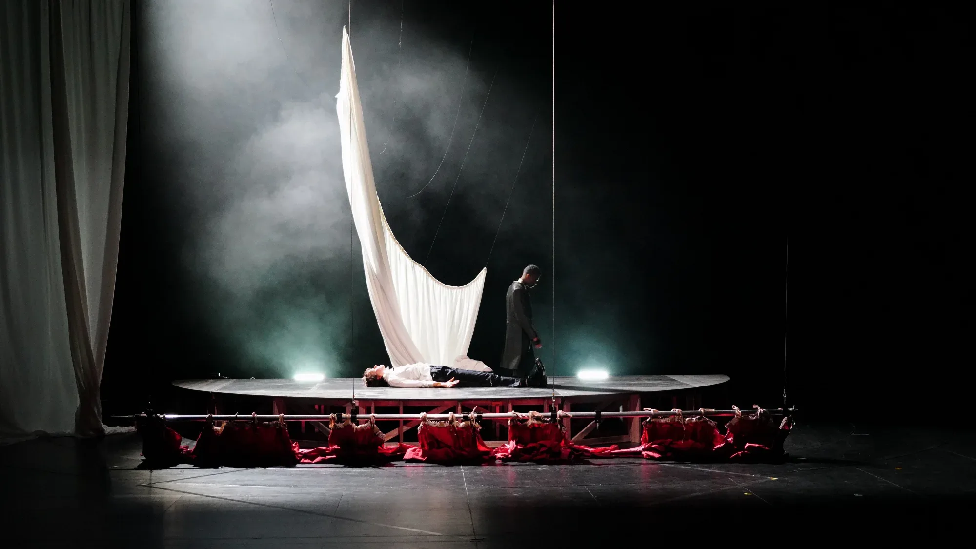 A spotlight on the white sail.