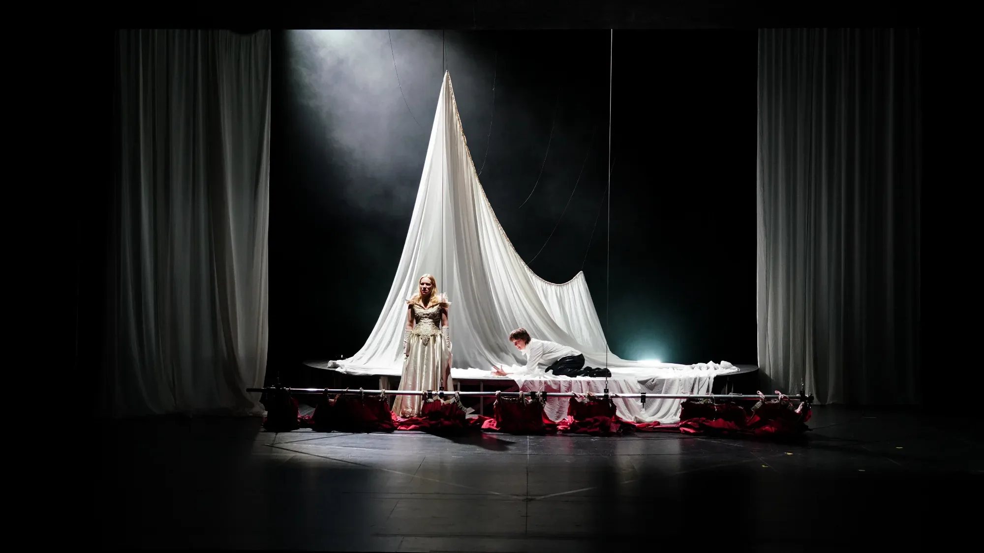 A white sail of fabric over the stage.