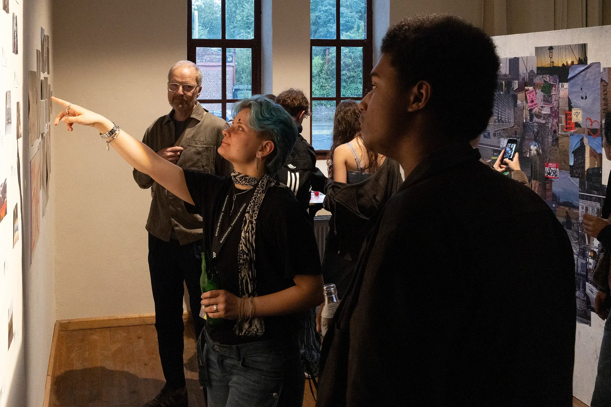 Visitors discuss a work in the exhibition.