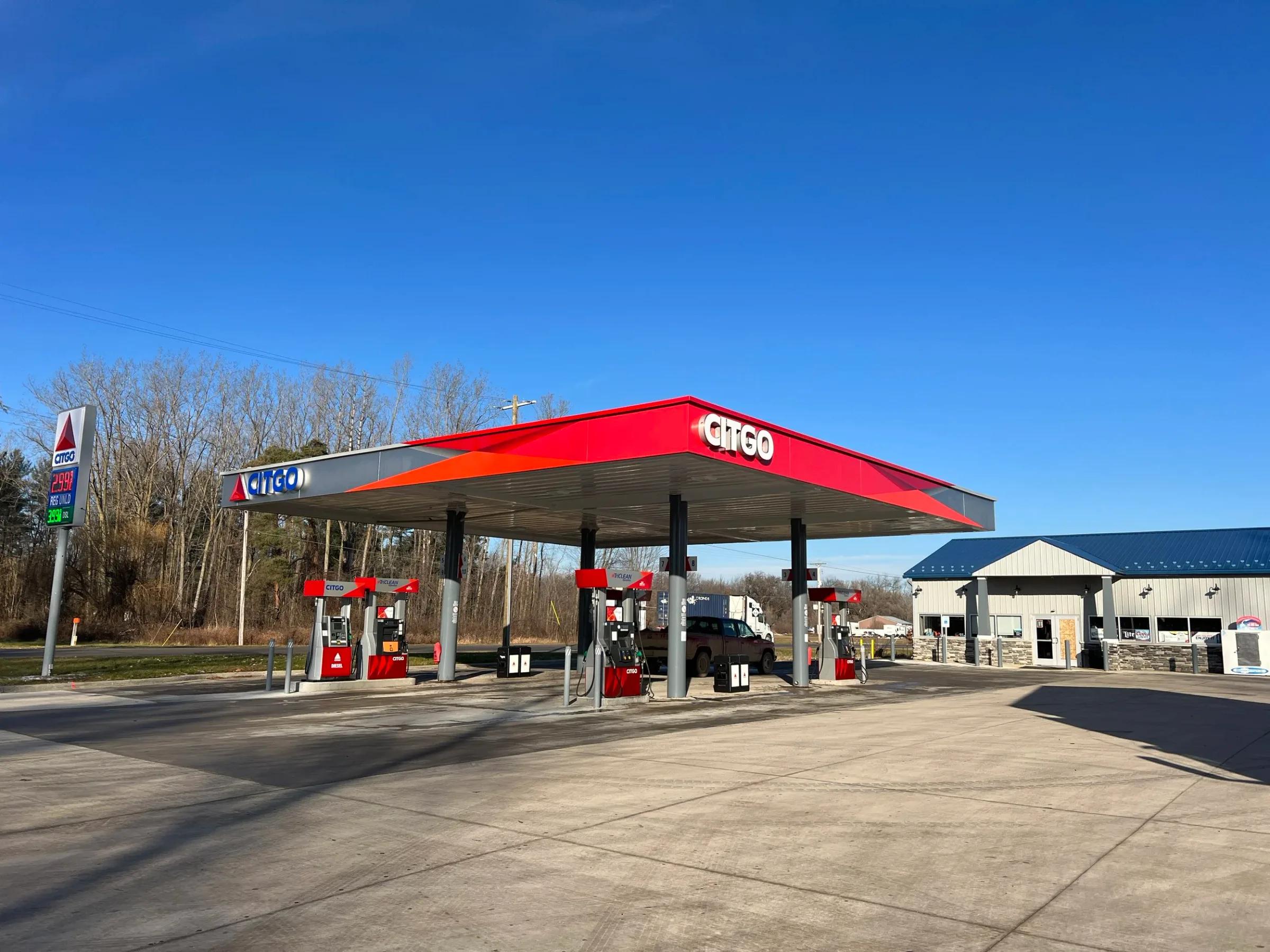 Citgo canopy with a red fascia over the pump islands on a sunny day