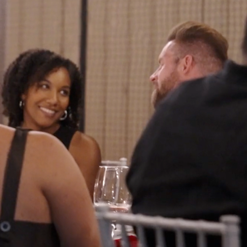 XVI guests engaged in conversation over dinner