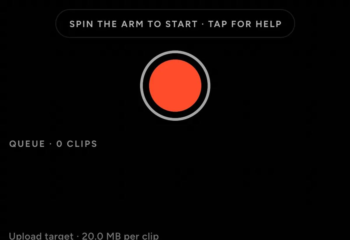 The bottom of the recorder, with a pill reading spin the arm to start, tap for help, a red shutter button, a queue count and an upload target line.