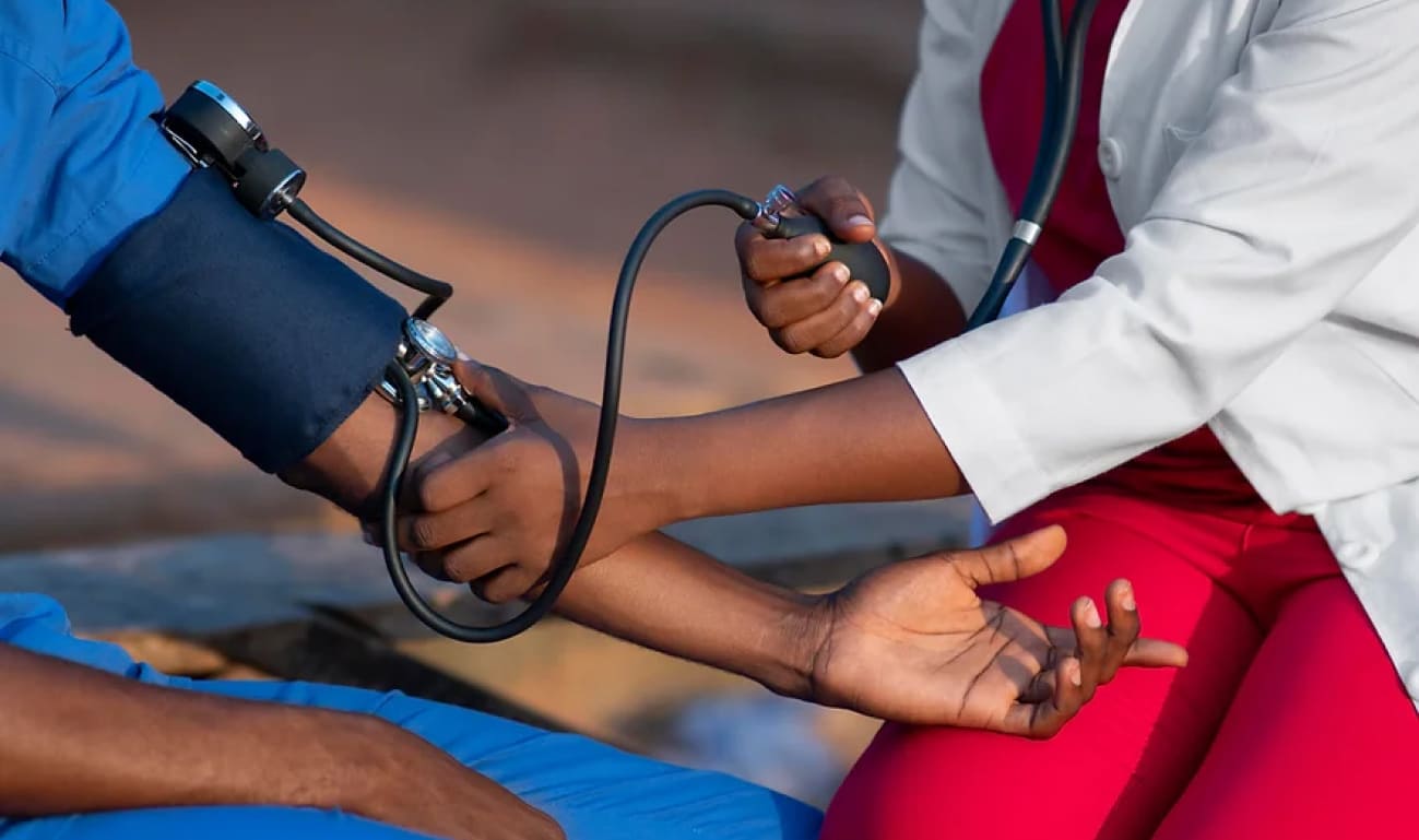 nurse checking a patient's blood pressure