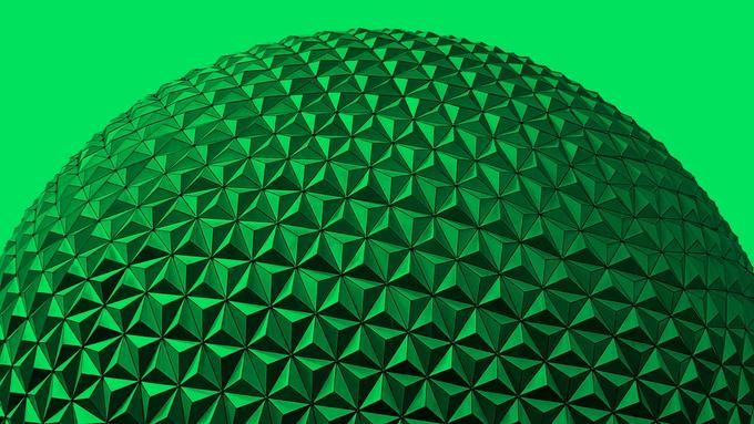 A close-up of EPCOT's Spaceship Earth geodesic sphere, tinted green