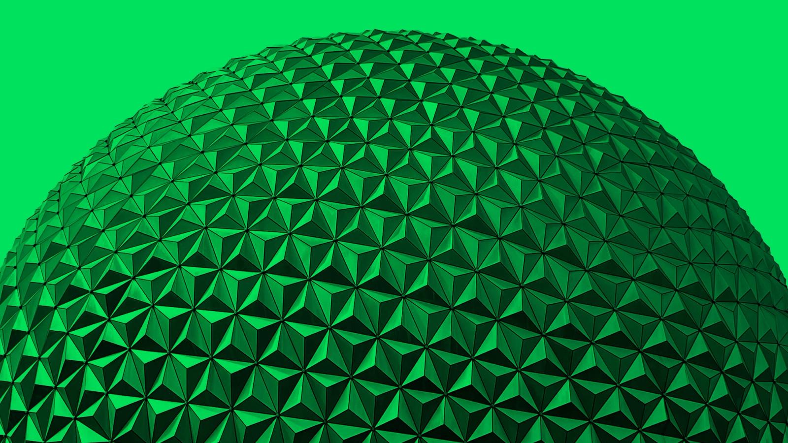 A close-up of EPCOT's Spaceship Earth geodesic sphere, tinted green
