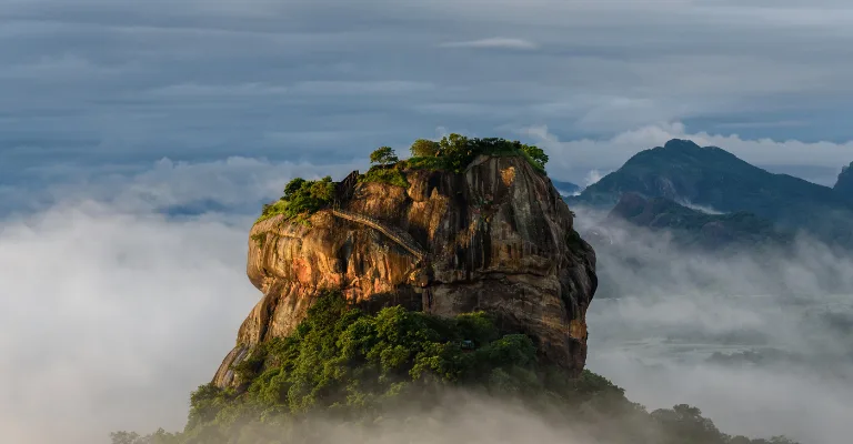 Sigiriya rock fortress rising above morning mist, Sri Lanka