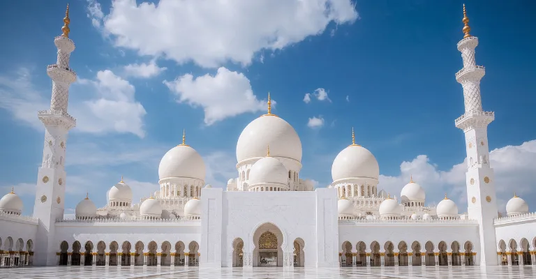 Sheikh Zayed Grand Mosque in Abu Dhabi with white marble domes and reflecting pools