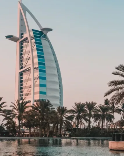 Aerial view of a coastal bridge and mountains, featured on the Dubai & Abu Dhabi Experience Tour homepage card