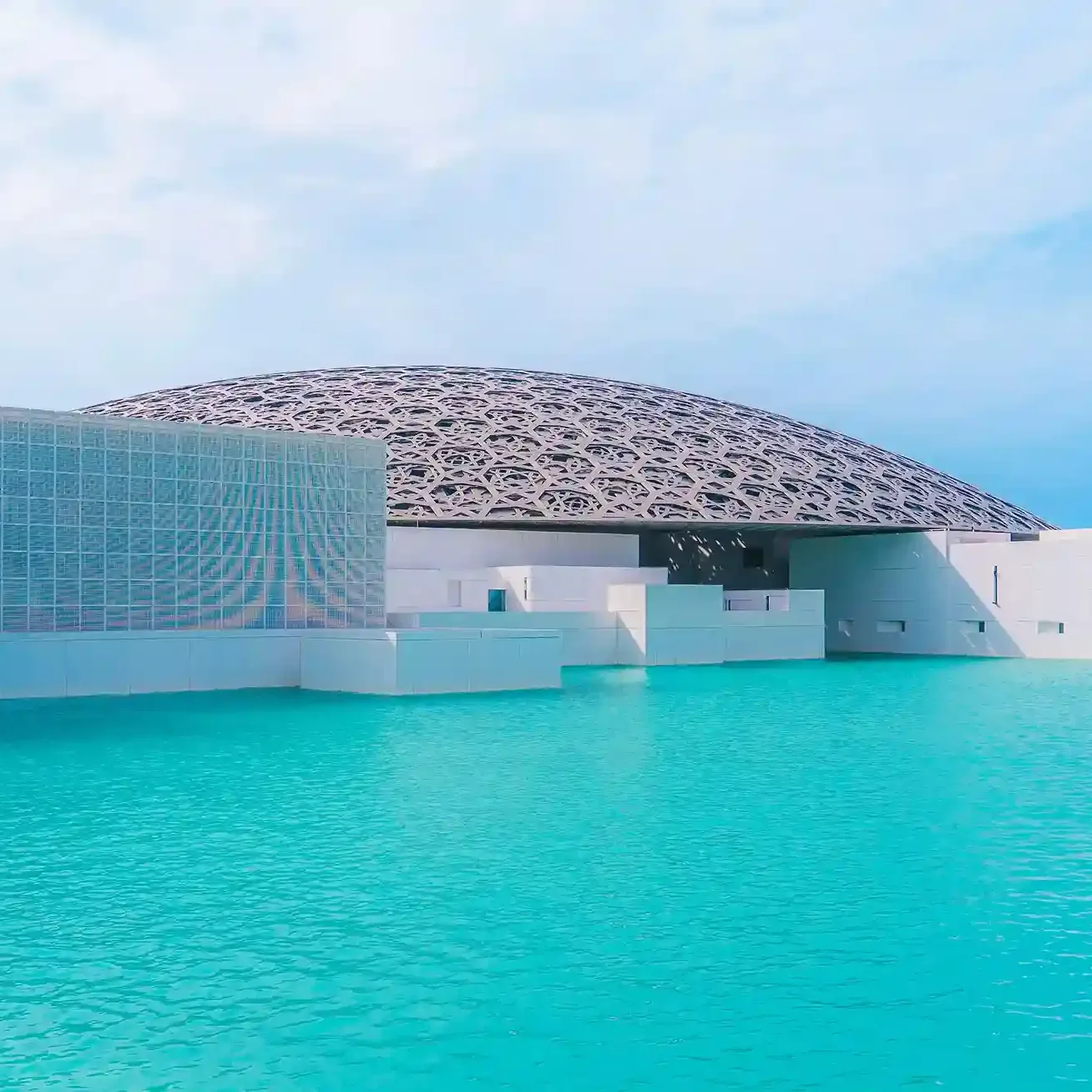 Louvre Abu Dhabi museum exterior with iconic dome architecture on Saadiyat Island