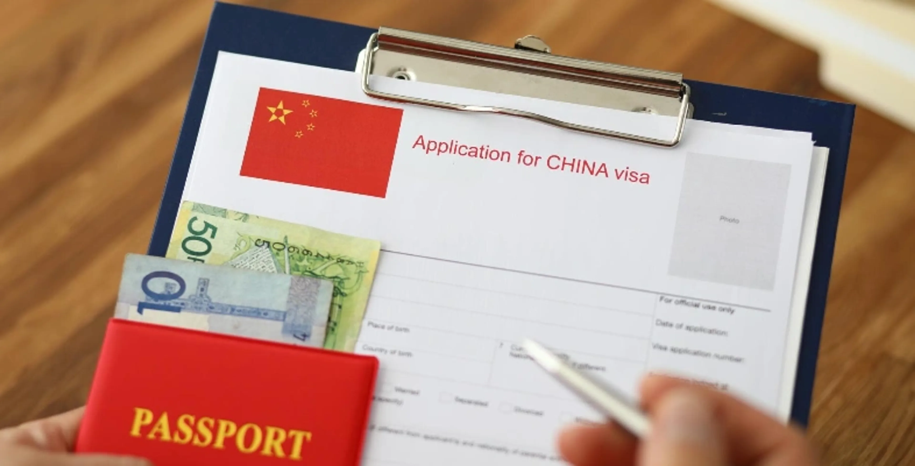 Traveller preparing documents for China visa application